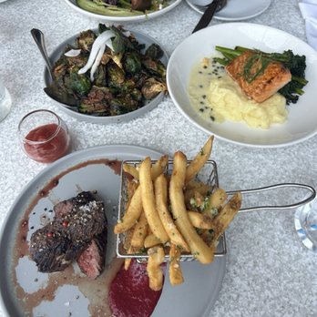 Castaway Burbank - PRIME HANGER STEAK 8oz with fries, Salmon with mashed potatoes and Brussels sprouts - Bars Near Me - Burbank, California