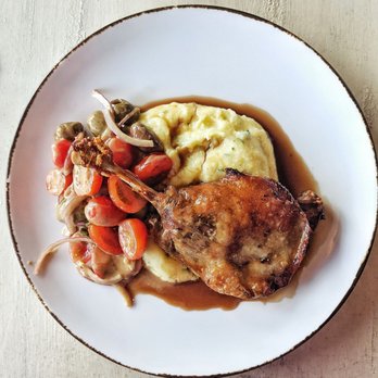 Fence & Post - A slow cooked duck leg on a bed of creamy polenta, jus and a balsamic tomato salad to break the richness. So good! - Canadian (New) Near Me - Cochrane, Alberta