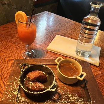1861 - Peach Bourbon Beignets and Brunch Punch. (Pic taken after two were already eaten) - Gastropubs Near Me - Middletown, Delaware