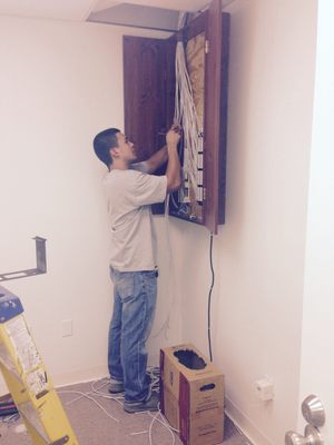 Photo of 3Packet.com - Anaheim, CA, US. Lots of cat5 cables mean lot of phones!!!!  The phone system will go in this cabinet.