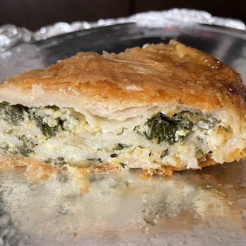 Three Brothers Restaurant - Cross section of spinach and cheese burek. - Desserts Near Me - Milwaukee, Wisconsin Three Brothers Restaurant - Cross section of spinach and cheese burek. - Desserts Near Me - Milwaukee, Wisconsin