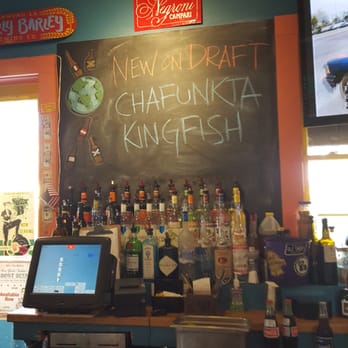 Dat Dog - Chalkboard with drink specials. Bar area is nice, and inviting. - Hot Dogs Near Me - New Orleans, Louisiana