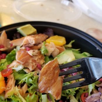 Benchmark Restaurant - Got the salmon salad to go. Disappointed to see this poultry skin in my salad. Makes me wonder how they handle their meat products. - American Near Me - Rosemont, Illinois