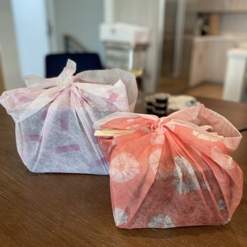 Jimmysugi - a pair of pink and white bags on a table - Japanese Near Me - Los Angeles, California Jimmysugi - a pair of pink and white bags on a table - Japanese Near Me - Los Angeles, California