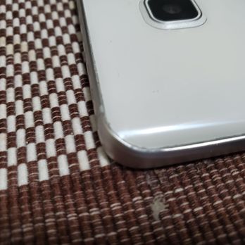 Green Zone Tech - Pic of phone with glue on the edges. - Mobile Phone Repair Near Me - Monterey Park, California Green Zone Tech - Pic of phone with glue on the edges. - Mobile Phone Repair Near Me - Monterey Park, California