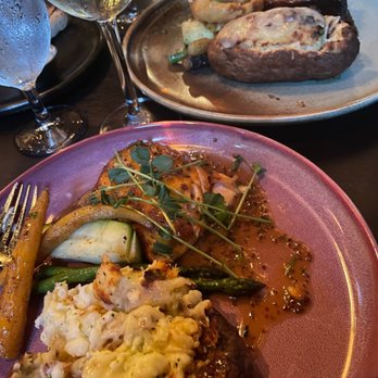 Claddagh Oyster House - Salmon with stuffed baked potato and braised short ribs with stuffed baked potato - Seafood Near Me - Charlottetown, Prince Edward Island Claddagh Oyster House - Salmon with stuffed baked potato and braised short ribs with stuffed baked potato - Seafood Near Me - Charlottetown, Prince Edward Island