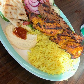 Al Basha Grill - Chicken and Lamb Shish Kebab plated with salad, pita, hummus and yellow rice. - Halal Near Me - Miami Beach, Florida
