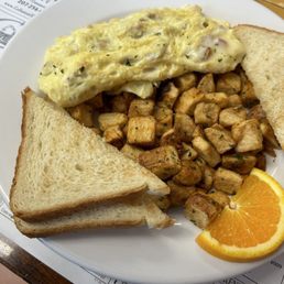Ham & cheese omelette with home fries and white toast Ham & cheese omelette with home fries and white toast