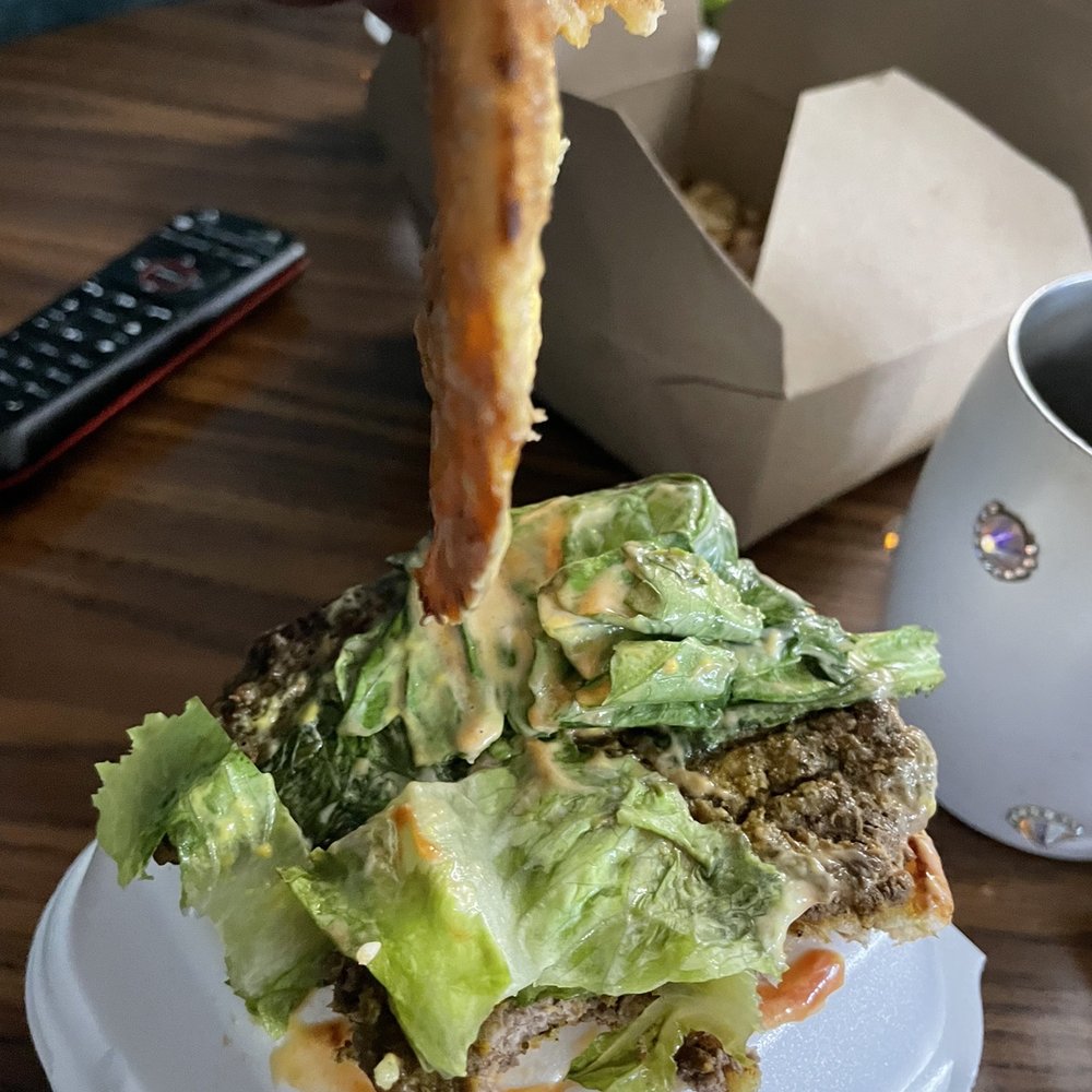 Expensive surfside soggy burger and cold fries. $30 bucks for 2 burgers and 1 fry. Expensive surfside soggy burger and cold fries. $30 bucks for 2 burgers and 1 fry.
