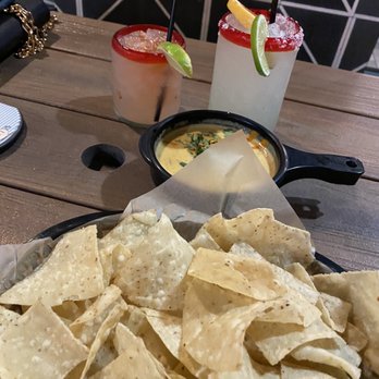 Torchy's Tacos - Watermelon marg on left, Paloma on right, queso in middle - Tacos Near Me - Austin, Texas Torchy's Tacos - Watermelon marg on left, Paloma on right, queso in middle - Tacos Near Me - Austin, Texas