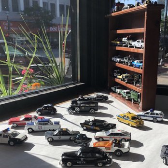 Cops & Doughnuts - Clare City Bakery - Miniature Police cars displayed in the front windows. - Bakeries Near Me - Clare, Michigan Cops & Doughnuts - Clare City Bakery - Miniature Police cars displayed in the front windows. - Bakeries Near Me - Clare, Michigan
