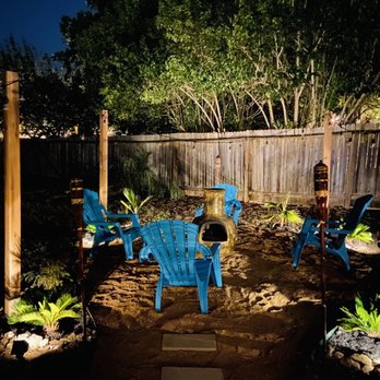 Lierre Landscaping & Design - a patio with blue chairs - Landscaping Near Me Lierre Landscaping & Design - a patio with blue chairs - Landscaping Near Me