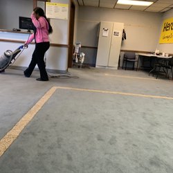 Hertz Rent A Car - The girl vacuuming, knowing I'm on hold, after she said I might want to go outside.