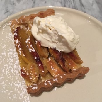 Slanted Door - Persimmon Tart fuyu persimmons, almond, whipped buttermilk mascarpone - Vietnamese Near Me - San Ramon, California Slanted Door - Persimmon Tart fuyu persimmons, almond, whipped buttermilk mascarpone - Vietnamese Near Me - San Ramon, California