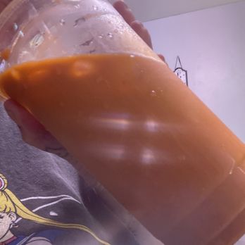 Best World Donuts - a person holding a cup of coffee - Donuts Near Me - Carson, California