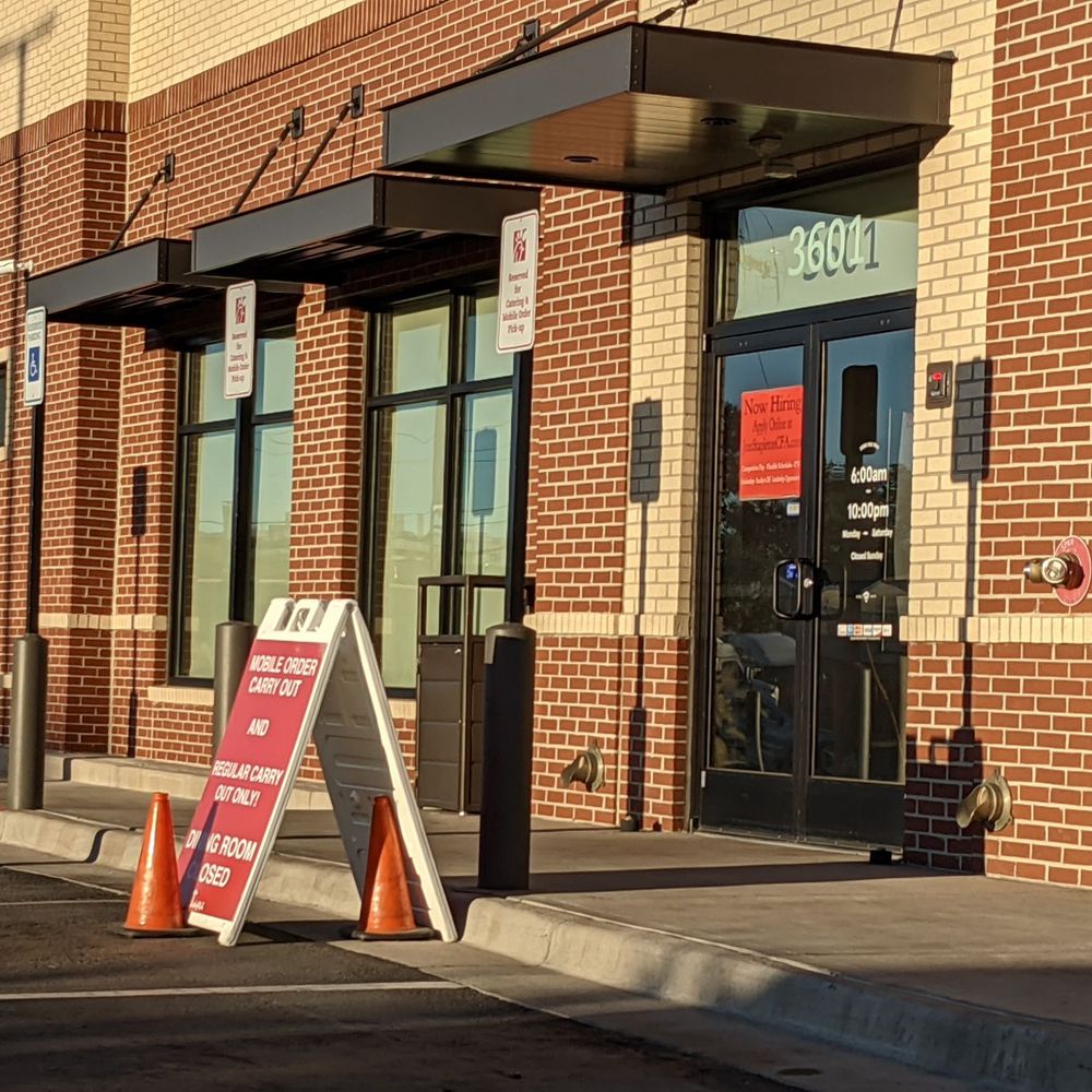 Chick-fil-A - ows a sign in front of a building - Fast Food Near Me - Denver, Colorado