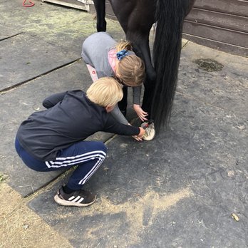 Double J Ranch - Cleaning Stix's hooves. - Horseback Riding Near Me - Montara, California Double J Ranch - Cleaning Stix's hooves. - Horseback Riding Near Me - Montara, California