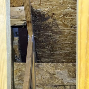 Rumble Bee Roofing - Attic water damage under chimney - Roofing Near Me