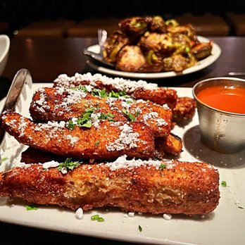 KR SteakBar - Eggplant Fries are a surprise with the powdered sugar and hot sauce. Intriguing. - Steakhouses Near Me - Atlanta, Georgia KR SteakBar - Eggplant Fries are a surprise with the powdered sugar and hot sauce. Intriguing. - Steakhouses Near Me - Atlanta, Georgia