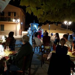 Teatro - Live opera singers in the piazza delight diners during a special gala event at the end of summer.