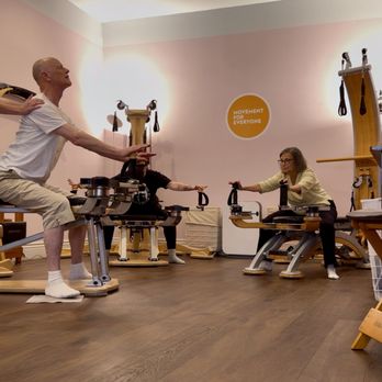 Movement For Everyone - Instructor providing hands-on cuing during Gyrotonic Pulley Tower group class. - Pilates Near Me - San Francisco, California Movement For Everyone - Instructor providing hands-on cuing during Gyrotonic Pulley Tower group class. - Pilates Near Me - San Francisco, California