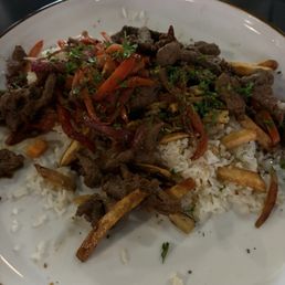 Loma soltuda. Beef with vegetables and fries Loma soltuda. Beef with vegetables and fries