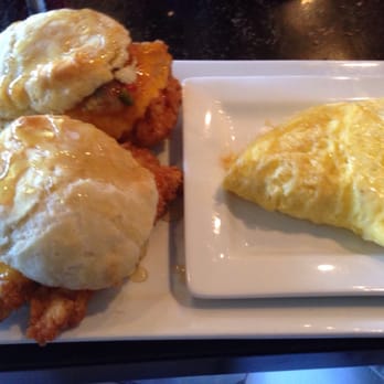 Crave Kitchen and Bar - Fried chicken honey biscuit sandwich with side of eggs. Very good if messy! - New American Near Me - El Paso, Texas Crave Kitchen and Bar - Fried chicken honey biscuit sandwich with side of eggs. Very good if messy! - New American Near Me - El Paso, Texas