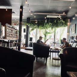 two people sitting at a table in a restaurant