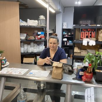 La Che Empanadas - The owner behind counter - Empanadas Near Me - San Antonio, Texas La Che Empanadas - The owner behind counter - Empanadas Near Me - San Antonio, Texas