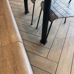 a table and chairs in a restaurant a table and chairs in a restaurant