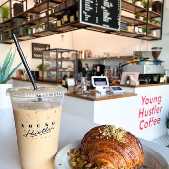 Young Hustler Coffee - Ice latte & Pistachio croissant - Coffee & Tea Near Me - Richmond, Texas Young Hustler Coffee - Ice latte & Pistachio croissant - Coffee & Tea Near Me - Richmond, Texas