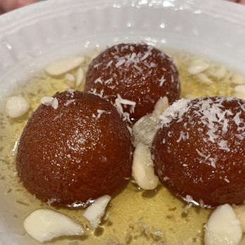Bolly Twist - Doughnuts in honey syrup with slivered almonds and shaved coconut - Indian Near Me - Stuart, Florida