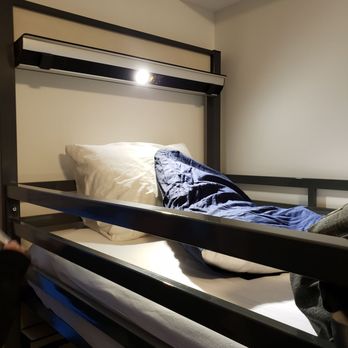 HI Jasper - The upper bunk with a reading light and multiple plugins. - Hostels Near Me - Jasper, Alberta