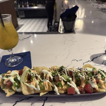 Waterfront - Tuna Tartare "Nachos" is incredible.  The wonton chips were crispy and flavorful.  The tuna was fresh and tasty.  Wasabi sauce excellent! - Lounges Near Me - Stuart, Florida