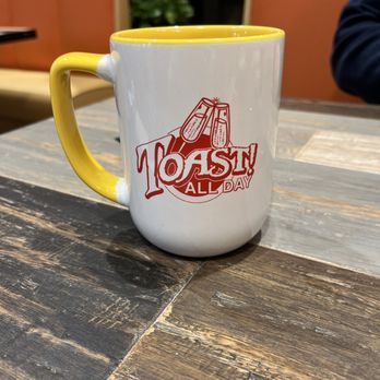 Toast! All Day - a coffee mug on a table - Breakfast & Brunch Near Me - Savannah, Georgia