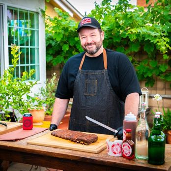 TNT Q and Catering - Chef Tim serving up some ribs - Caterers Near Me TNT Q and Catering - Chef Tim serving up some ribs - Caterers Near Me