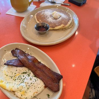 Snooze, an A.M. Eatery - Pancake with eggs and bacon - Breakfast & Brunch Near Me - Webster, Texas Snooze, an A.M. Eatery - Pancake with eggs and bacon - Breakfast & Brunch Near Me - Webster, Texas