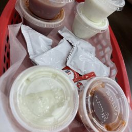 Sauces (spicy & tzatziki) and ketchup. Sauces (spicy & tzatziki) and ketchup.