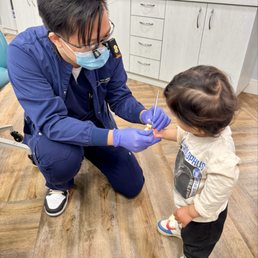 Dr. Norman showing our toddler the mirror Dr. Norman showing our toddler the mirror