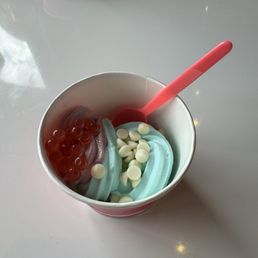 Cotton candy froyo w/ white choco chips, and berry tart froyo w/ strawberry popping pearls