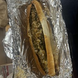 Large cheese steak with peppers onions and provolone. Added some hot sauce. Large cheese steak with peppers onions and provolone. Added some hot sauce.