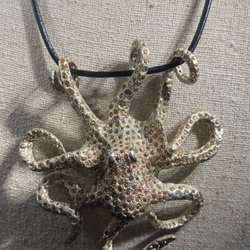 Clark's Jewelers - 18k white gold Octopus with 18.54 carats of padparadscha sapphires, and 1 carat of diamonds.