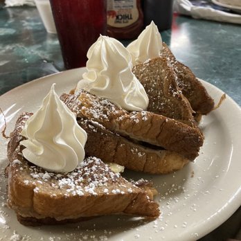 Clary's Cafe - The Elvis-French toast with a Memphis spin of banana and peanut butter. - Breakfast & Brunch Near Me - Savannah, Georgia Clary's Cafe - The Elvis-French toast with a Memphis spin of banana and peanut butter. - Breakfast & Brunch Near Me - Savannah, Georgia