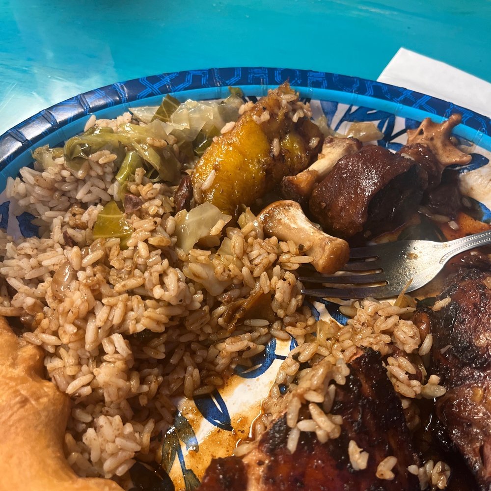 The Jamaican Spot - a plate of food on a table - Caribbean Near Me - Leesville, Louisiana The Jamaican Spot - a plate of food on a table - Caribbean Near Me - Leesville, Louisiana