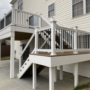 T&H Home Improvements - a deck with stairs and railings - General Contractors Near Me T&H Home Improvements - a deck with stairs and railings - General Contractors Near Me