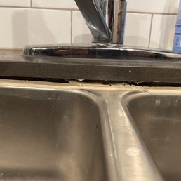 The sink is glued on the granite countertop. The sink is glued on the granite countertop.