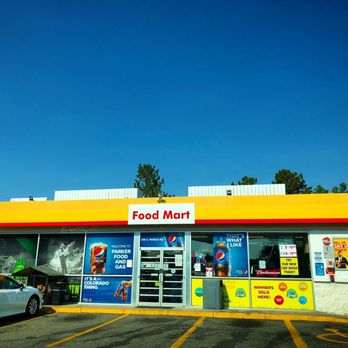 Shell - a car parked in front of a food mart - Gas Stations Near Me - Aurora, Colorado