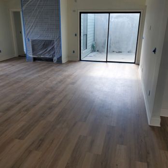 Nexus Flooring - an empty room with a sliding glass door - Flooring Near Me - Jacksonville, Florida