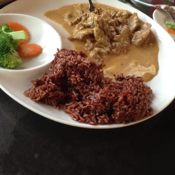 Manao Thai Street Eats - Pork curry with wild rice!  Not spicy at all because you add your own with chili pepper flakes at the table. - Thai Near Me - Seattle, Washington