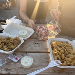 Lobster roll, clams and onion rings Lobster roll, clams and onion rings